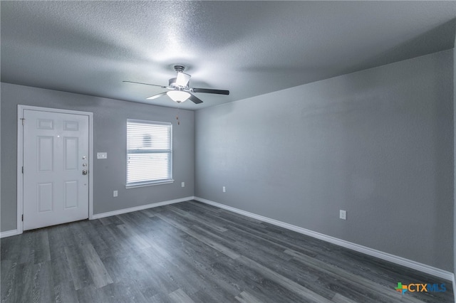 entrance foyer with a textured ceiling, dark hardwood / wood-style flooring, and ceiling fan