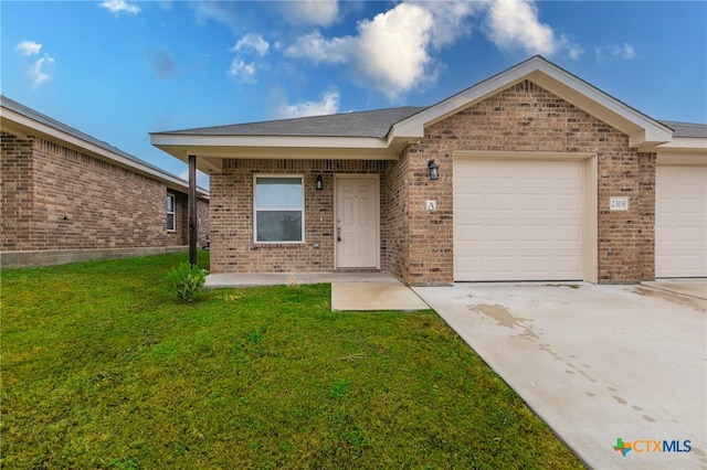 ranch-style house with a front yard and a garage