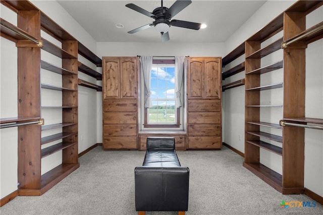 12491 Madison Ln, Justin, TX 76247 - walk in closet featuring light carpet and ceiling fan