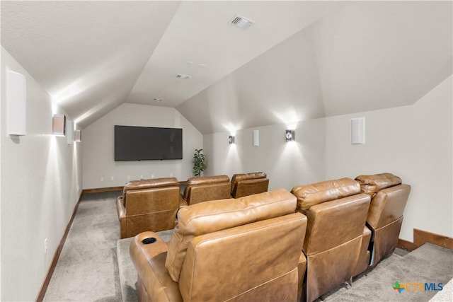 12491 Madison Ln, Justin, TX 76247 - home theater room featuring light carpet, lofted ceiling, and baseboards