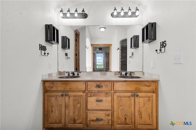 12491 Madison Ln, Justin, TX 76247 - bathroom with double vanity and ceiling fan