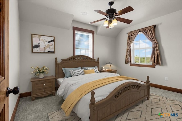 12491 Madison Ln, Justin, TX 76247 - bedroom featuring baseboards, light carpet, multiple windows, and ceiling fan
