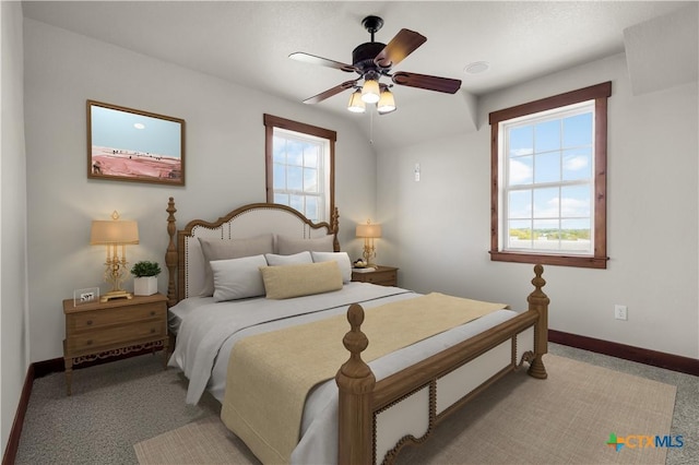 12491 Madison Ln, Justin, TX 76247 - bedroom featuring light colored carpet, baseboards, and ceiling fan