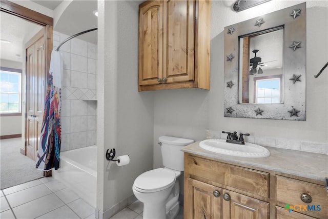 12491 Madison Ln, Justin, TX 76247 - bathroom with toilet, vanity, shower / bathtub combination with curtain, baseboards, and tile patterned flooring