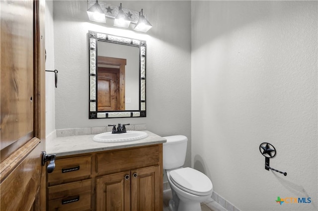 12491 Madison Ln, Justin, TX 76247 - bathroom featuring toilet and vanity