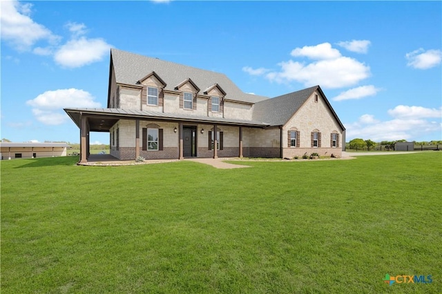 12491 Madison Ln, Justin, TX 76247 - view of front of home with a front yard, stone siding, brick siding, and covered porch