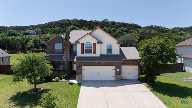 3608 Quail Ridge Dr, Harker Heights, TX 76548 - view of front of property with brick siding, driveway, an attached garage, and roof with shingles