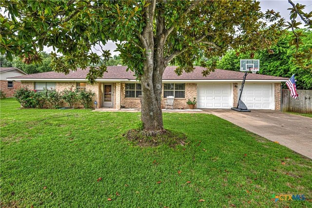 3117 Magnolia Blvd, Temple, TX 76502 - view of front of home with driveway, an attached garage, and brick siding