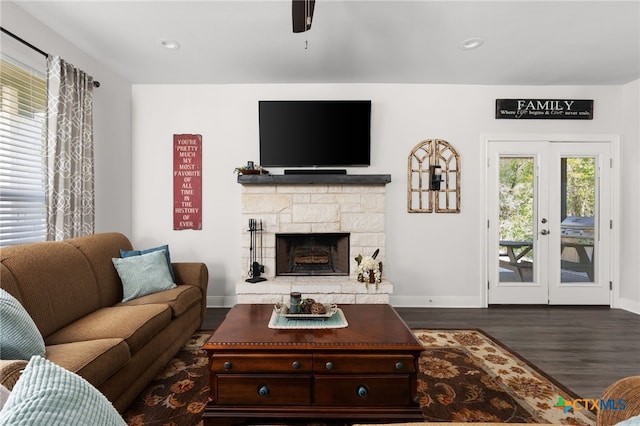 127 Diamond Head Dr, Bastrop, TX 78602 - living area with dark wood-type flooring, baseboards, a stone fireplace, and recessed lighting