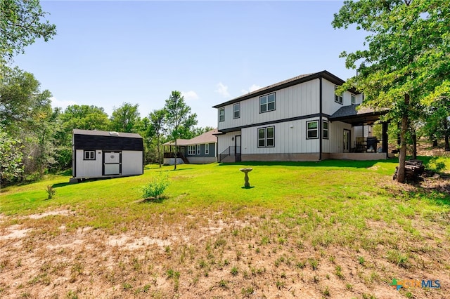 127 Diamond Head Dr, Bastrop, TX 78602 - back of house featuring a lawn