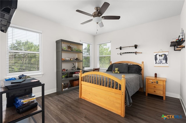 127 Diamond Head Dr, Bastrop, TX 78602 - bedroom with baseboards, dark wood-style flooring, and a ceiling fan