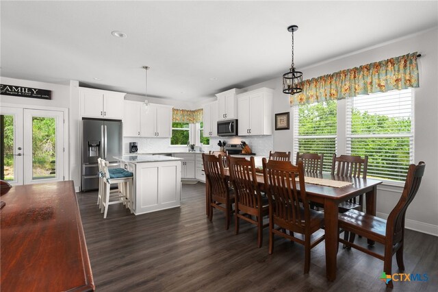 127 Diamond Head Dr, Bastrop, TX 78602 - kitchen featuring appliances with stainless steel finishes, a sink, white cabinets, and backsplash