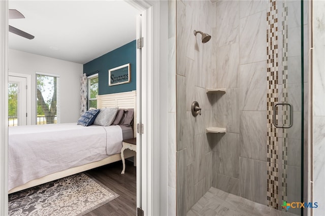 127 Diamond Head Dr, Bastrop, TX 78602 - bathroom with double vanity, plenty of natural light, a bath, and wood finished floors