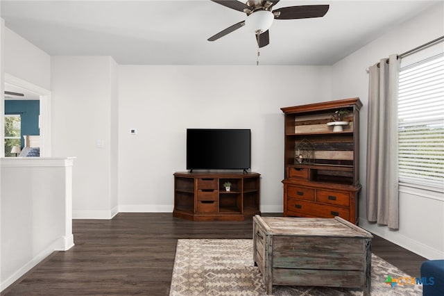 127 Diamond Head Dr, Bastrop, TX 78602 - living area featuring ceiling fan, dark wood finished floors, and baseboards
