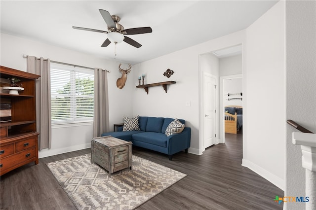 127 Diamond Head Dr, Bastrop, TX 78602 - living room with a ceiling fan, dark wood-type flooring, and baseboards