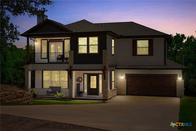 127 Diamond Head Dr, Bastrop, TX 78602 - view of front of home featuring a balcony, a front yard, stone siding, and board and batten siding