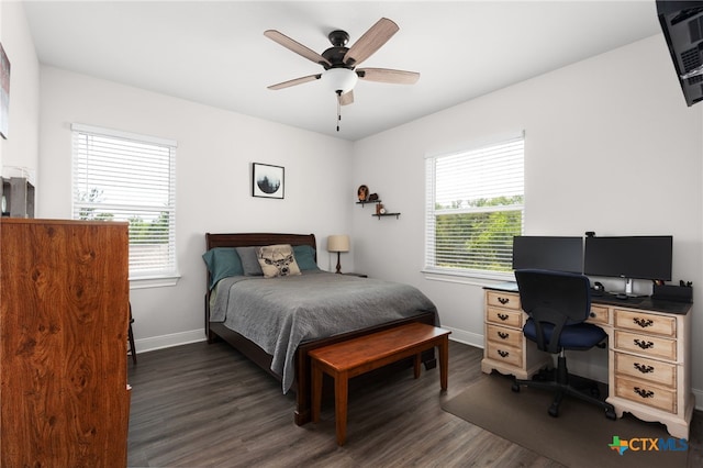 127 Diamond Head Dr, Bastrop, TX 78602 - bedroom with dark wood-type flooring, an office area, baseboards, and a ceiling fan