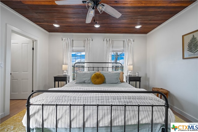 bedroom featuring wooden ceiling, ceiling fan, ornamental molding, and wood-type flooring