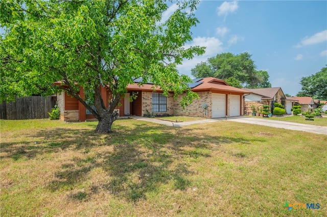 ranch-style home with a garage and a front lawn