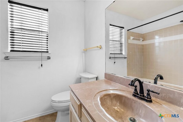 bathroom with tile patterned floors, a shower, toilet, and vanity