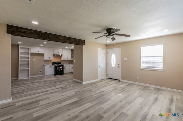 entrance foyer with beamed ceiling, ceiling fan, a textured ceiling, and light hardwood / wood-style flooring