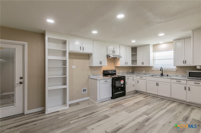 kitchen featuring light wood-type flooring, white cabinetry, sink, and black range with electric cooktop