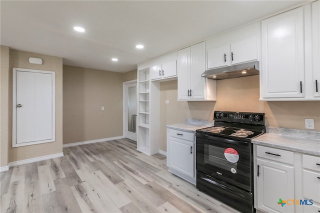 kitchen featuring black / electric stove, white cabinetry, and light hardwood / wood-style flooring