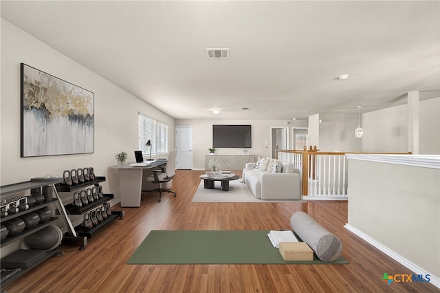 exercise room featuring hardwood / wood-style flooring