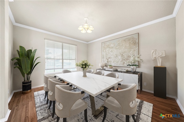 dining room featuring a chandelier, dark hardwood / wood-style floors, and crown molding