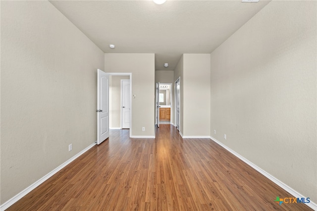 unfurnished bedroom featuring dark wood-type flooring