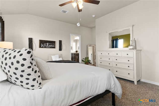 carpeted bedroom with ceiling fan, connected bathroom, and lofted ceiling