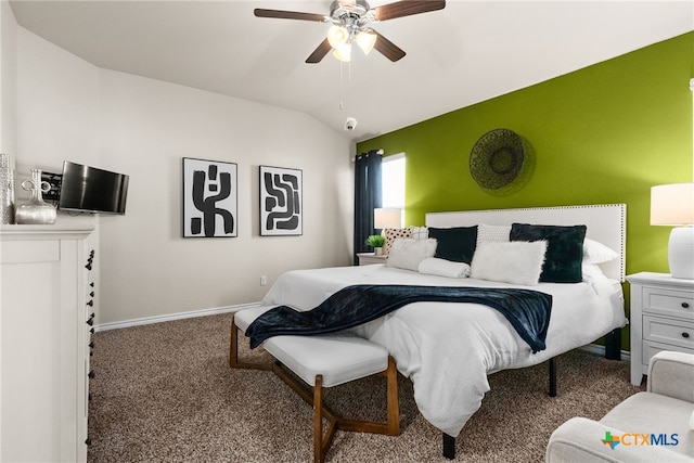 carpeted bedroom featuring ceiling fan and lofted ceiling