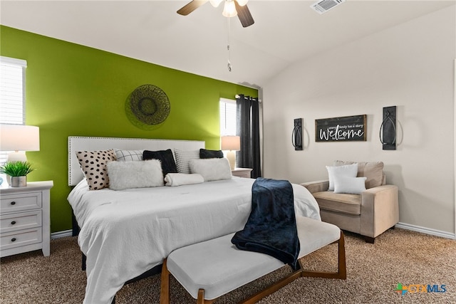 carpeted bedroom with lofted ceiling, multiple windows, and ceiling fan