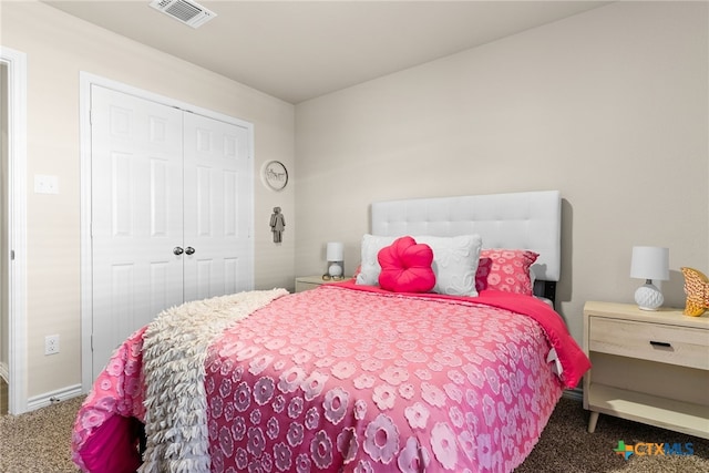 carpeted bedroom featuring a closet