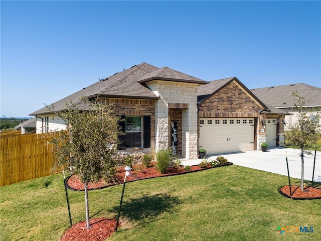 view of front of property with a garage and a front yard