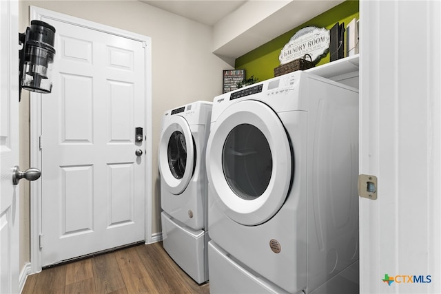 laundry area featuring separate washer and dryer and wood-type flooring