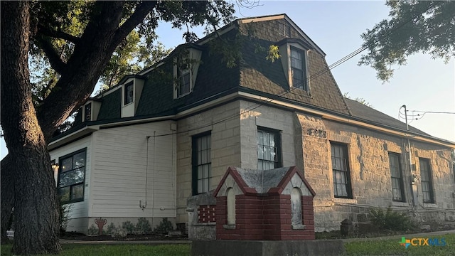 400 S Main St, Belton, TX 76513 - view of front of home with mansard roof, roof with shingles, and stone siding