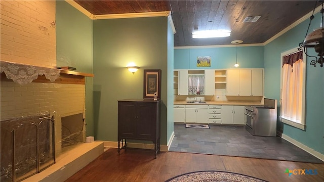 400 S Main St, Belton, TX 76513 - bathroom featuring ornamental molding, a fireplace with raised hearth, wood ceiling, and wood finished floors