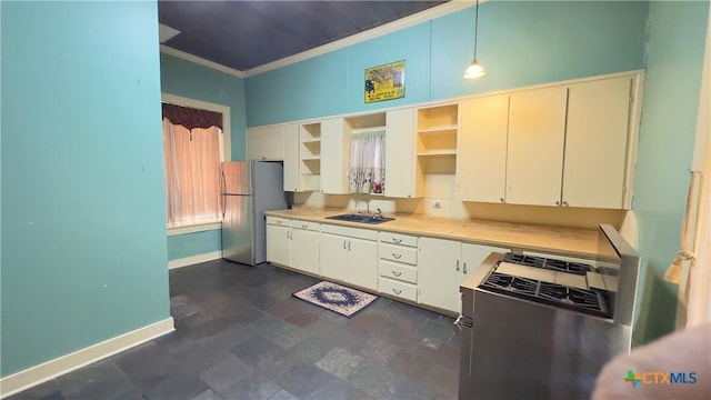 400 S Main St, Belton, TX 76513 - kitchen with freestanding refrigerator, open shelves, stove, crown molding, and light countertops