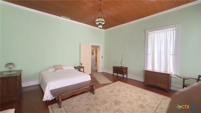 400 S Main St, Belton, TX 76513 - bedroom featuring wood ceiling, wood finished floors, and ornamental molding