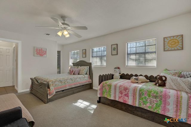 bedroom featuring visible vents, carpet floors, baseboards, and ceiling fan