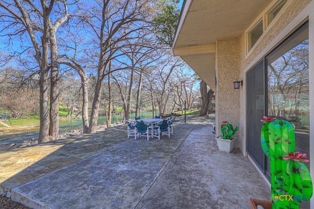 view of patio featuring outdoor dining area