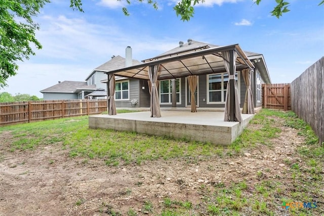 610 Hobby Rd, Copperas Cove, TX 76522 - back of house with a patio, a chimney, a gazebo, and a fenced backyard