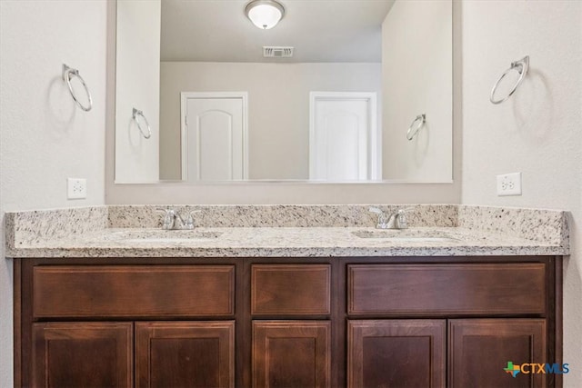 610 Hobby Rd, Copperas Cove, TX 76522 - full bathroom with visible vents, double vanity, and a sink