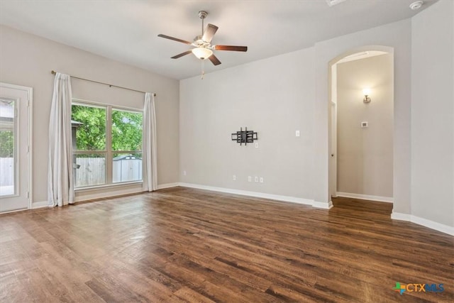 610 Hobby Rd, Copperas Cove, TX 76522 - empty room with ceiling fan, wood finished floors, baseboards, and arched walkways
