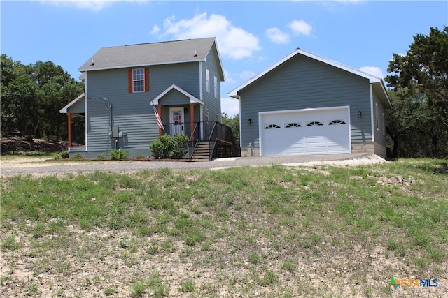 view of front of house with a garage and a front yard