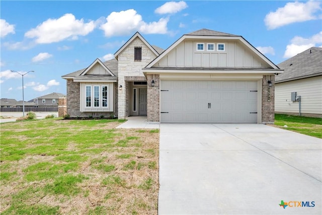 1531 Hillside Dr, Temple, TX 76502 - view of front of property featuring board and batten siding, driveway, and brick siding