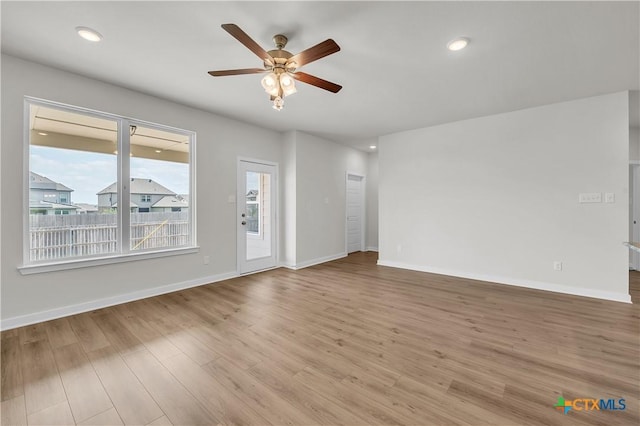 1531 Hillside Dr, Temple, TX 76502 - unfurnished living room featuring a ceiling fan, wood finished floors, baseboards, and recessed lighting