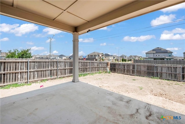 1531 Hillside Dr, Temple, TX 76502 - fenced backyard with a residential view and a patio area
