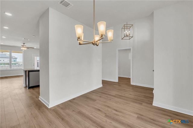 1531 Hillside Dr, Temple, TX 76502 - unfurnished dining area featuring wood finished floors, a chandelier, recessed lighting, baseboards, and ceiling fan